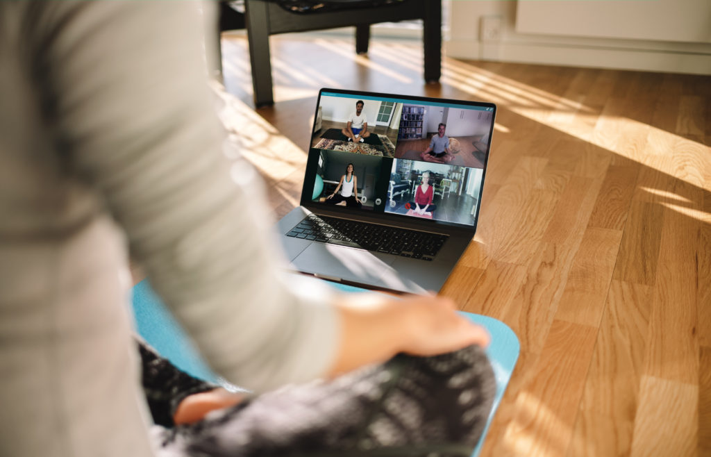 Group,Of,People,Practicing,Yoga,With,Trainer,Via,Video,Conference.