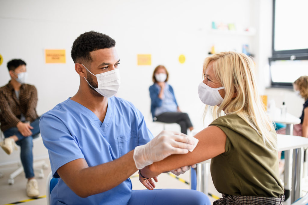 Old,Woman,With,Face,Mask,Getting,Vaccinated,,Coronavirus,,Covid-19,And